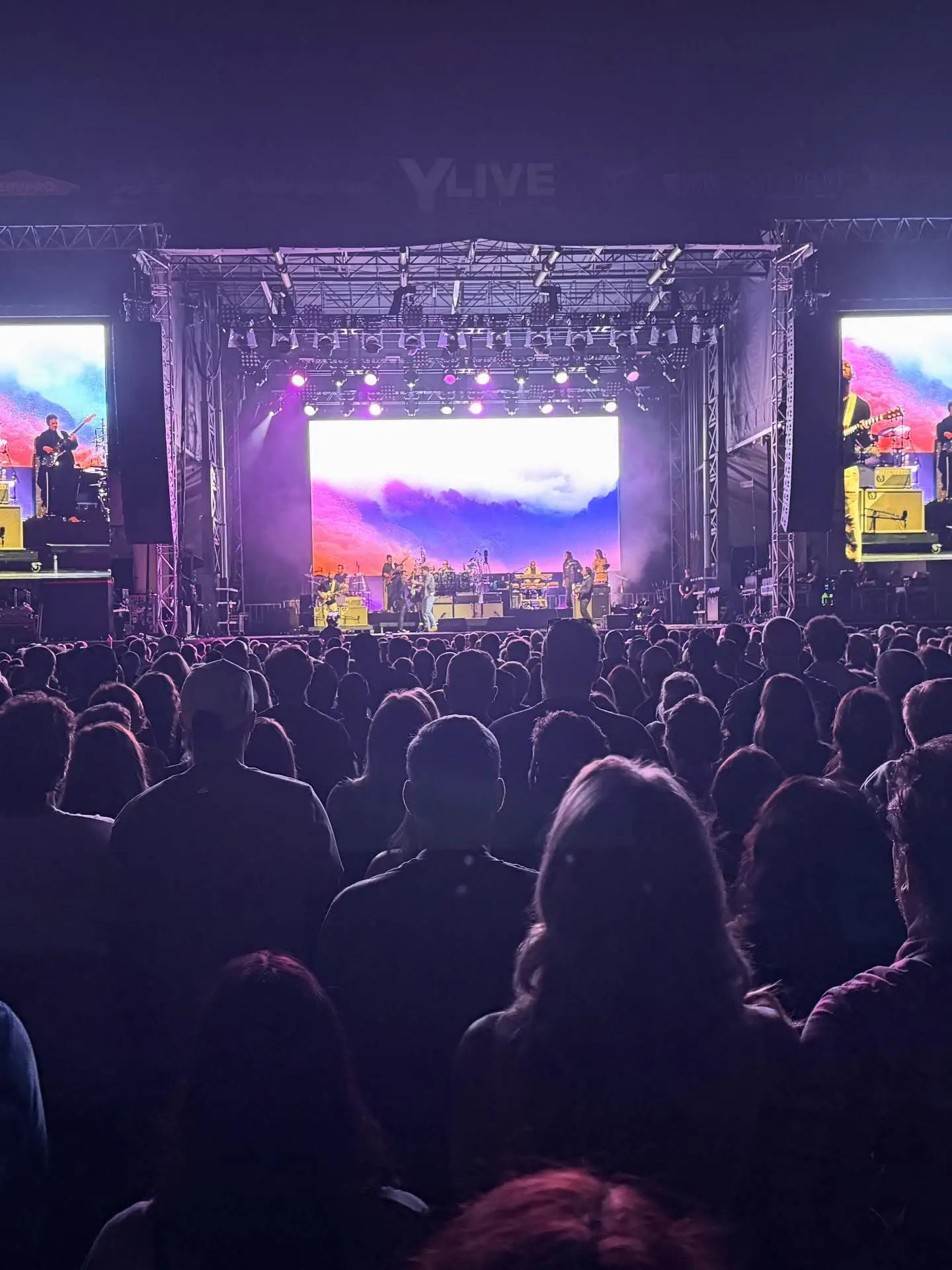 Stage lighting trusses and LED wall during performance